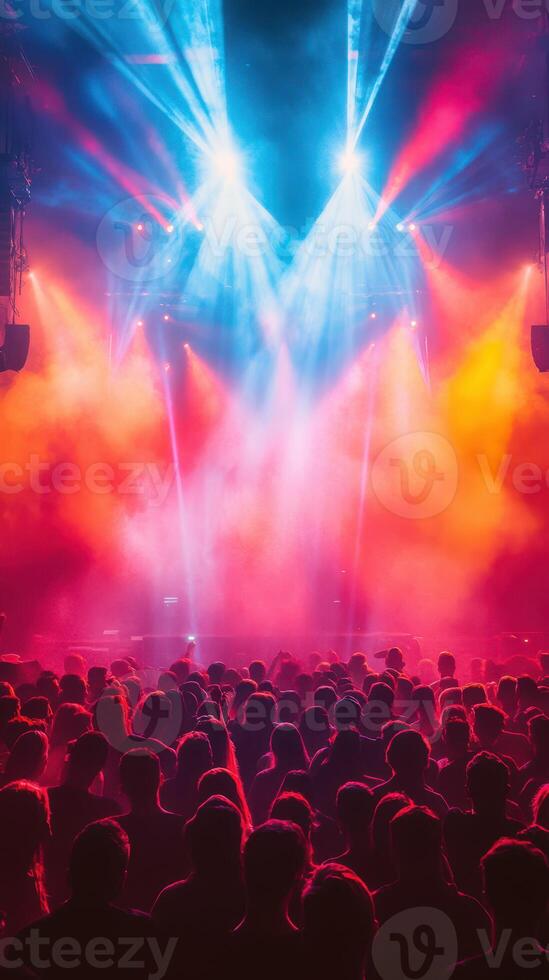 Vibrant concert atmosphere fills the venue with dynamic lights and energetic crowd during live music performance at night photo