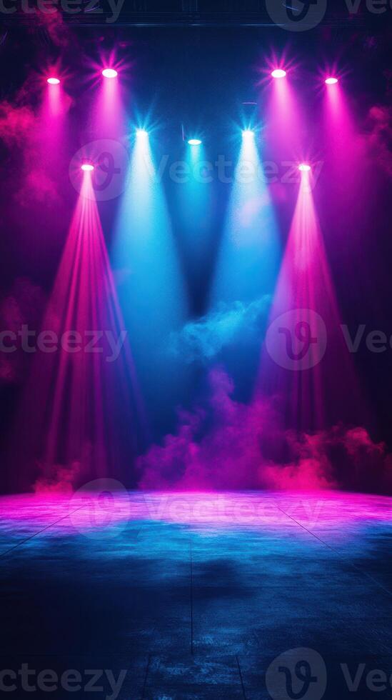 Colorful stage lighting illuminates a performance area with vibrant pink and blue hues creating an electrifying atmosphere photo