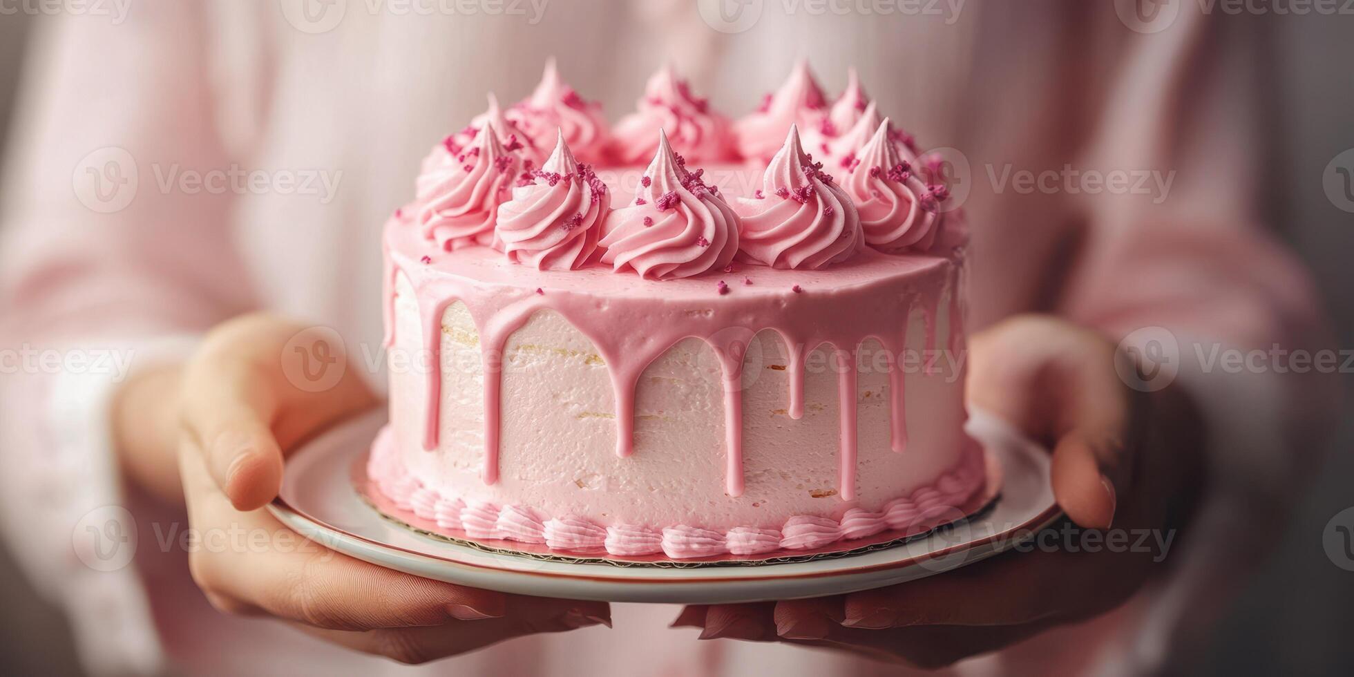 Delicious pink frosting cake held by a person in a light setting with soft natural light photo