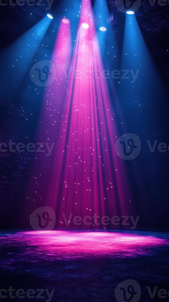 Colorful light beams create a vibrant atmosphere in an empty stage setting at night photo