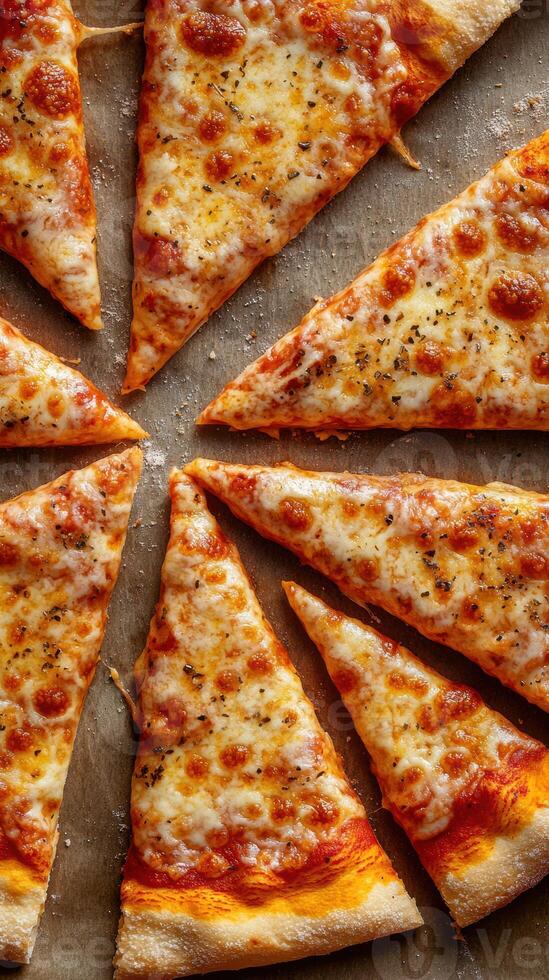 Delicious cheese pizza slices arranged in a circular pattern on a baking sheet photo