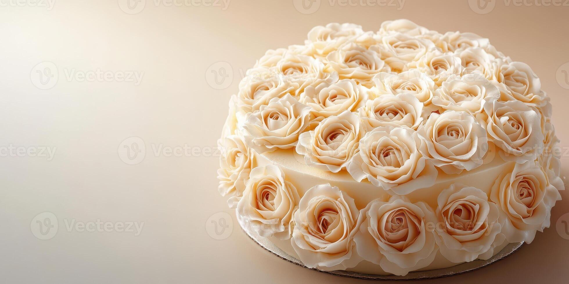 Elegant wedding cake adorned with delicate rose decorations in a soft warm setting photo