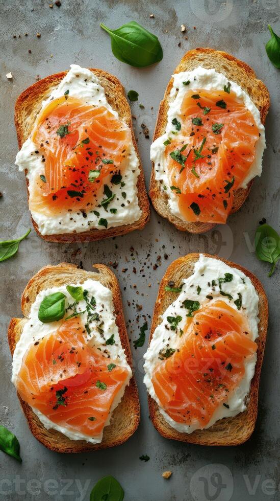 Fresh salmon and cheese toast served on whole grain bread, topped with herbs photo