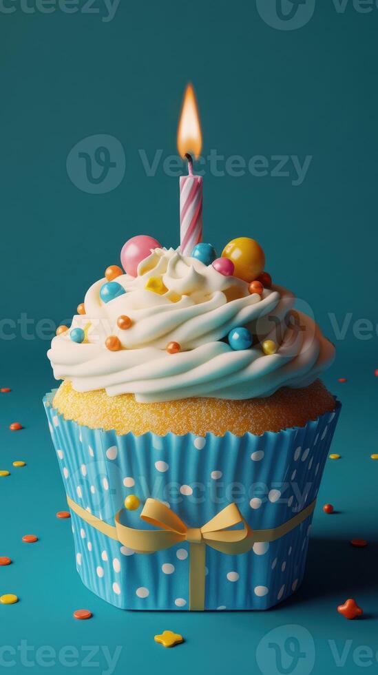 Colorful cupcake with frosting and candle on blue background for a festive celebration photo