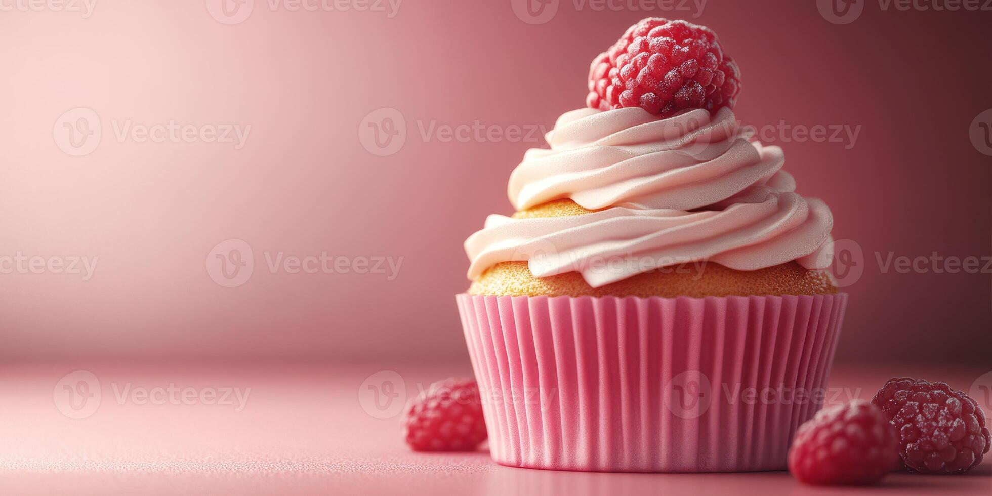 Delicious raspberry cupcake with fluffy frosting and fresh berries on a soft pink background photo