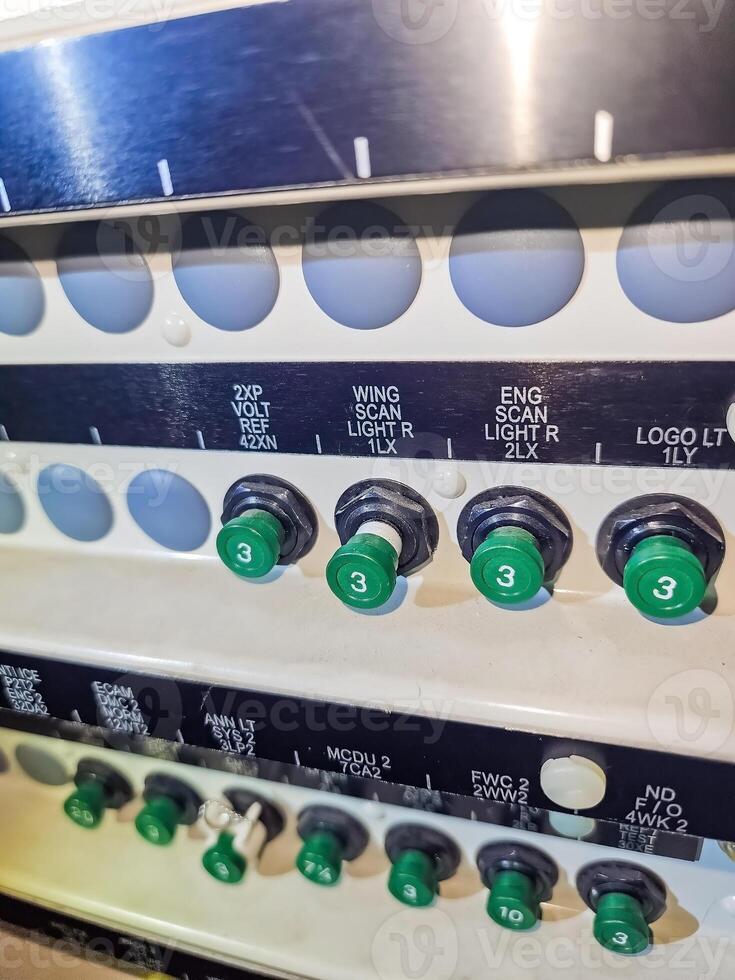 Aircraft Cockpit Overhead Panel Detail. Switches, Lights, Gauges, and Labels in Airplane. High quality photo