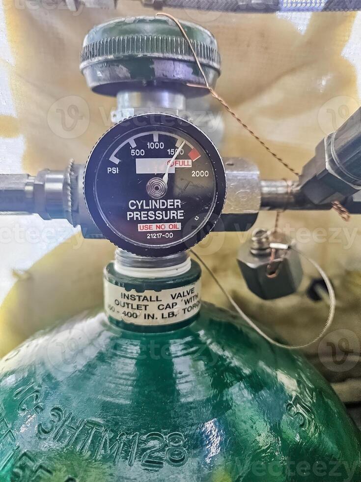 Close-up of a high-pressure gas cylinder with a regulator and gauge reading. High quality photo