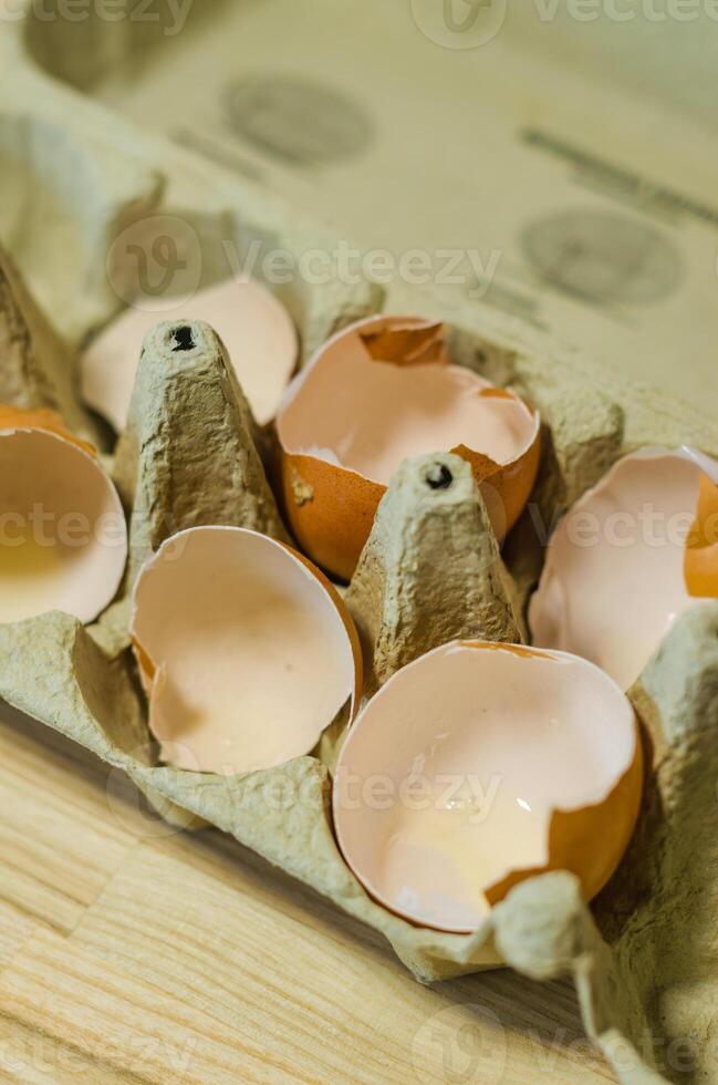 broken Eggshells in carton. Symbolism, fragility, beginnings, food waste. High quality photo