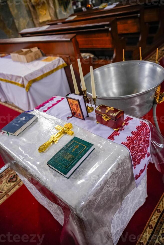 Close-up of a table used for preparing for baptism in an Orthodox church photo