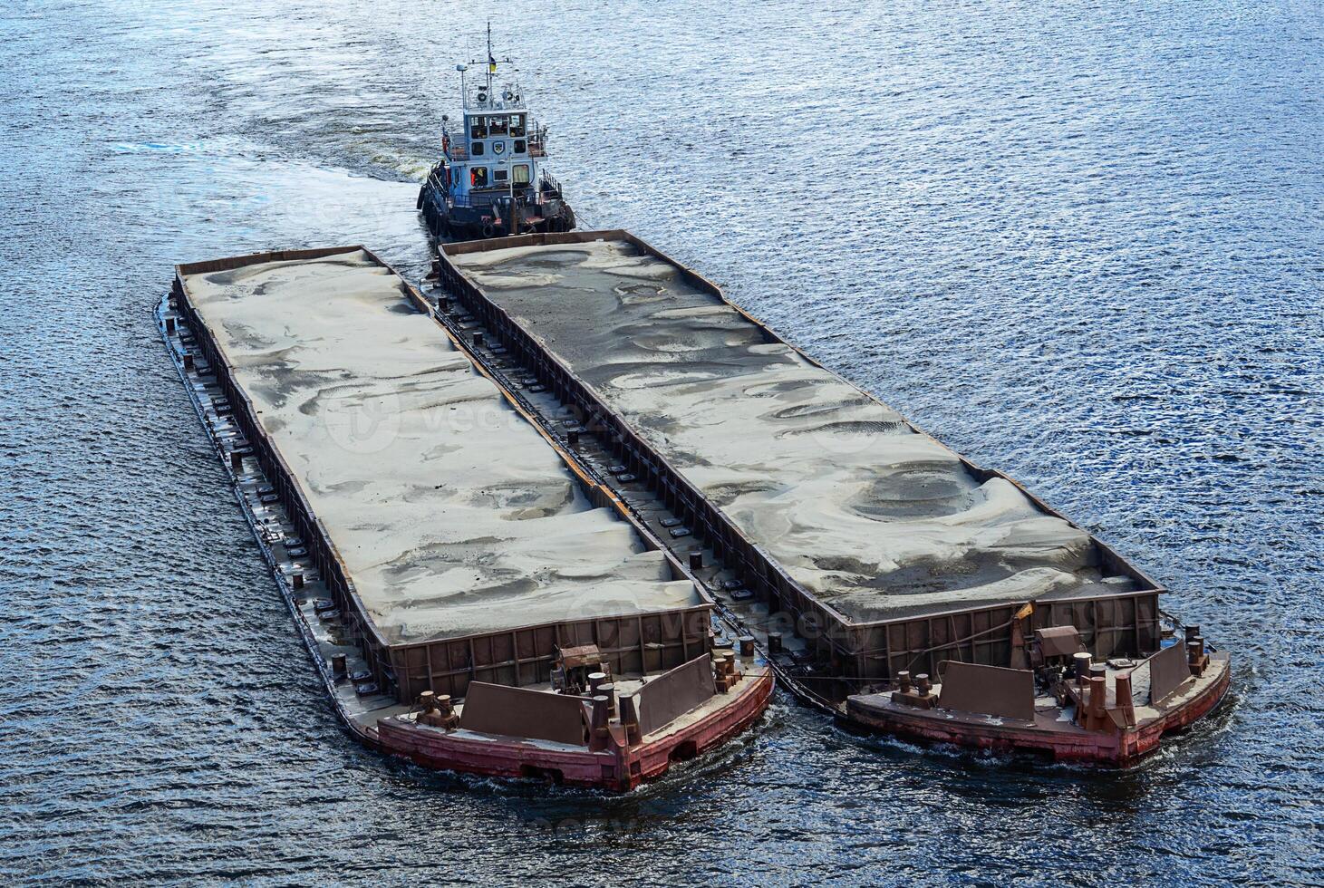 Barges loaded with sand photo
