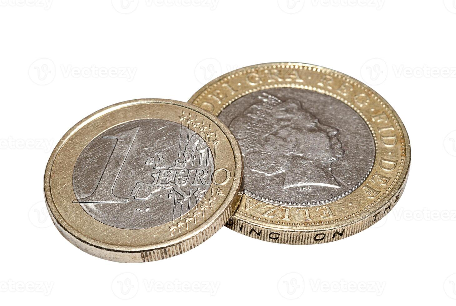 One euro and two British pounds closeup photo
