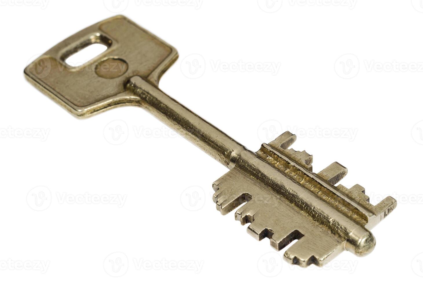 Bronze key on white background closeup photo