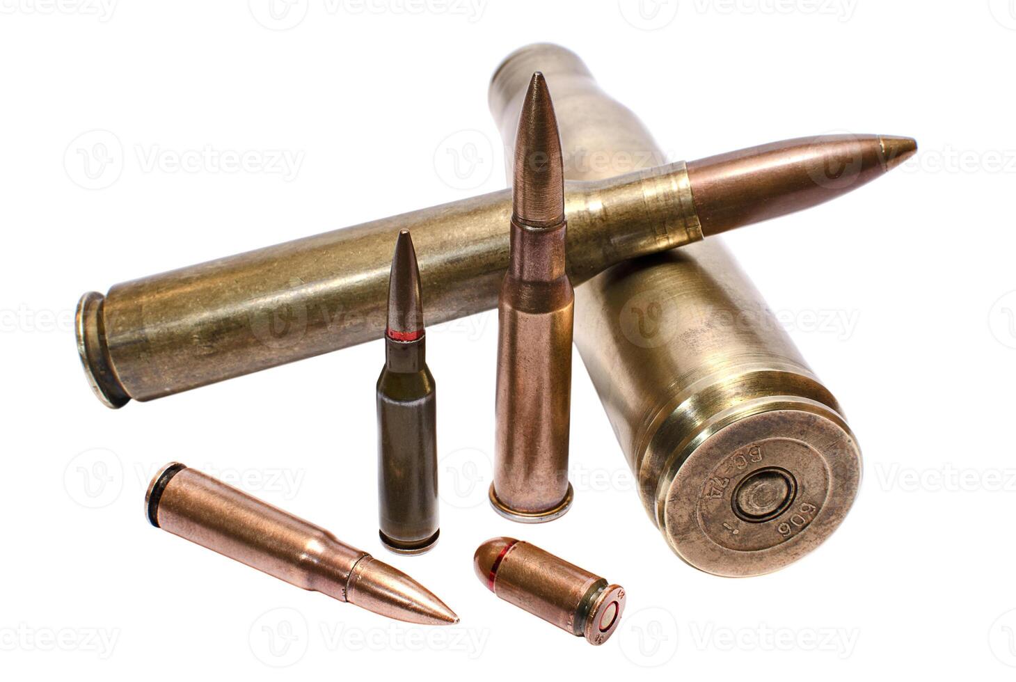 Cartridges for large-caliber machine-gun, assault rifle and handgun closeup photo