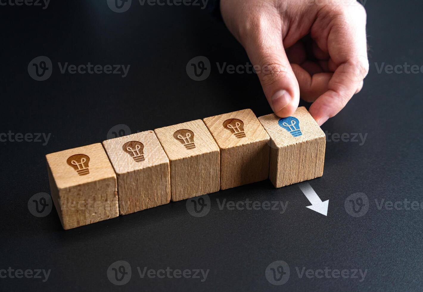 The hand puts forward a promising idea. Creativity, brainstorming. Business startup, breakthrough thinking. New opportunities, leadership. Great idea, inspiration, bright future, innovation success. photo
