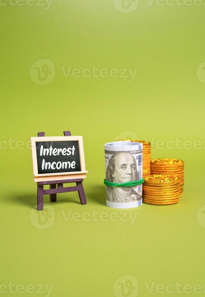 Interest income and a stack of money. Profits earned through interest rates, passive income strategies, wealth accumulation, banking services, and financial planning for future stability. photo