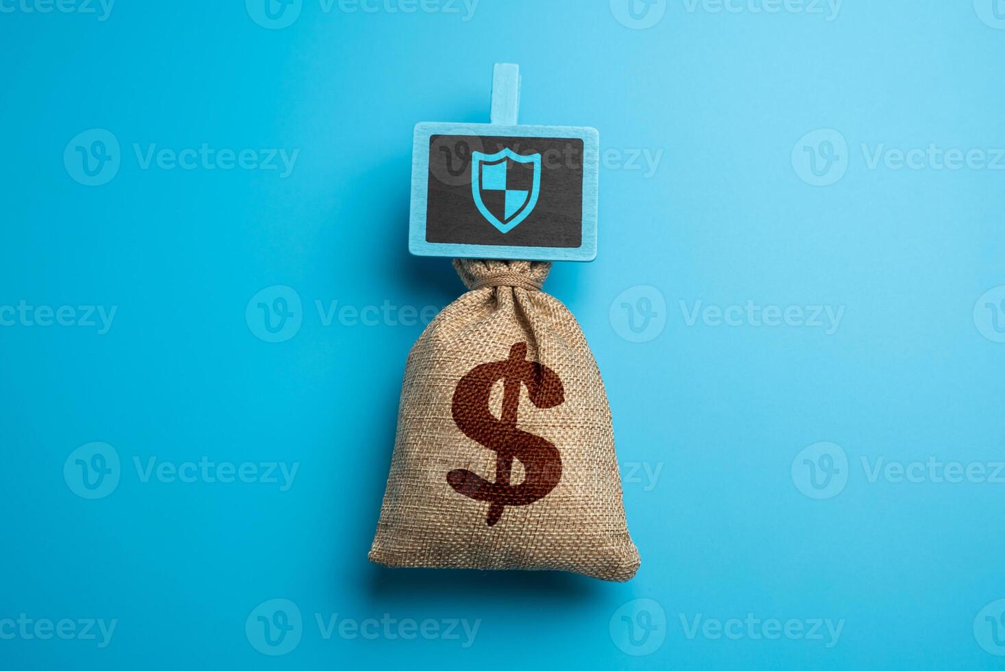 A bag of money for protection and security. Insurance, savings, investment protection, and financial planning. Safeguarding assets. Cybersecurity photo
