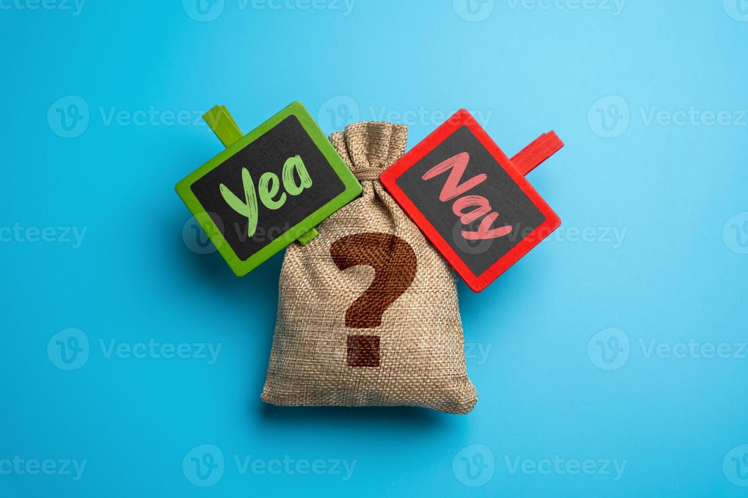 Bag with question and signs Yea or Nay. Voting, business choices, or financial investments. Consequences of selecting between two opposing paths photo