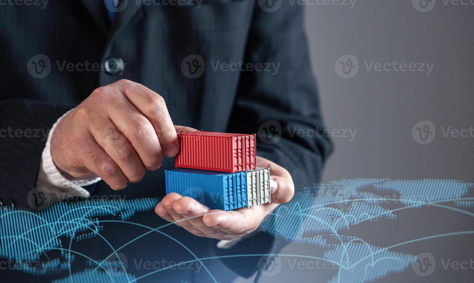 Businessman holding shipping containers against world trade map. Global trade, logistics, and commerce. Symbolizing international supply chains, exports, imports, and the expansion of global markets. photo
