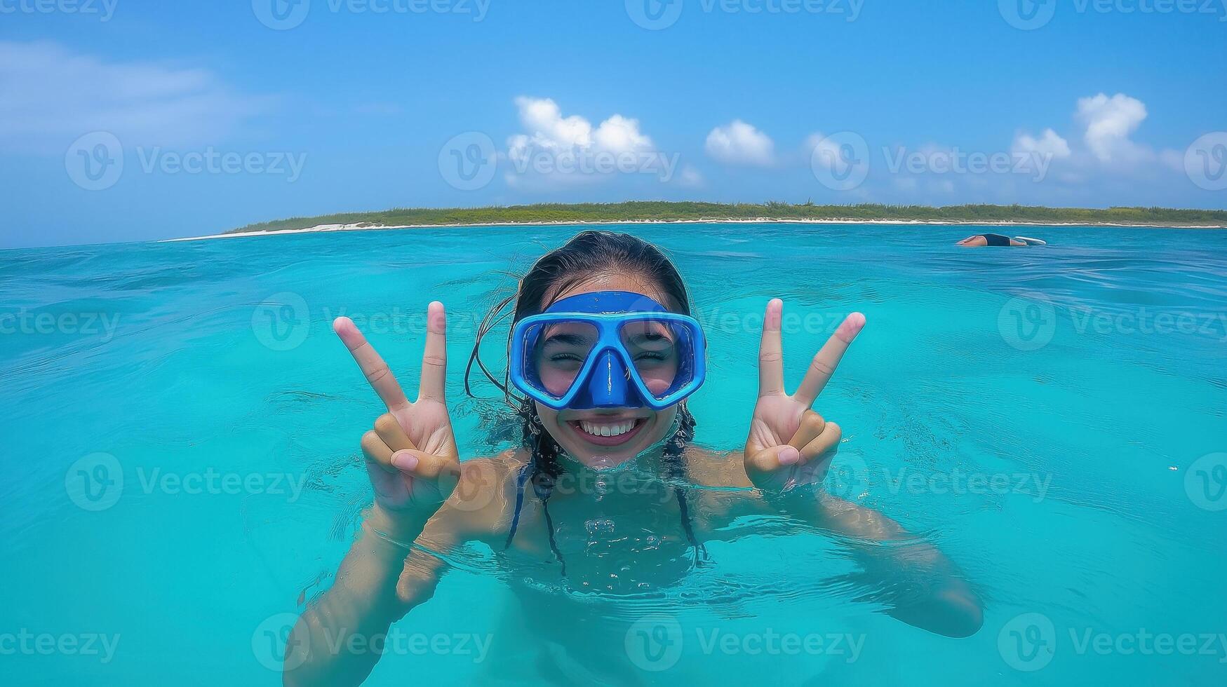 A woman wearing a snorgle in the ocean photo