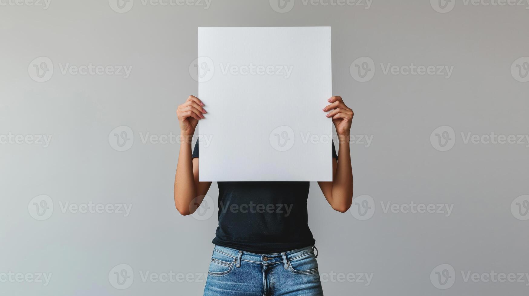 A person holding up a blank paper over their head photo