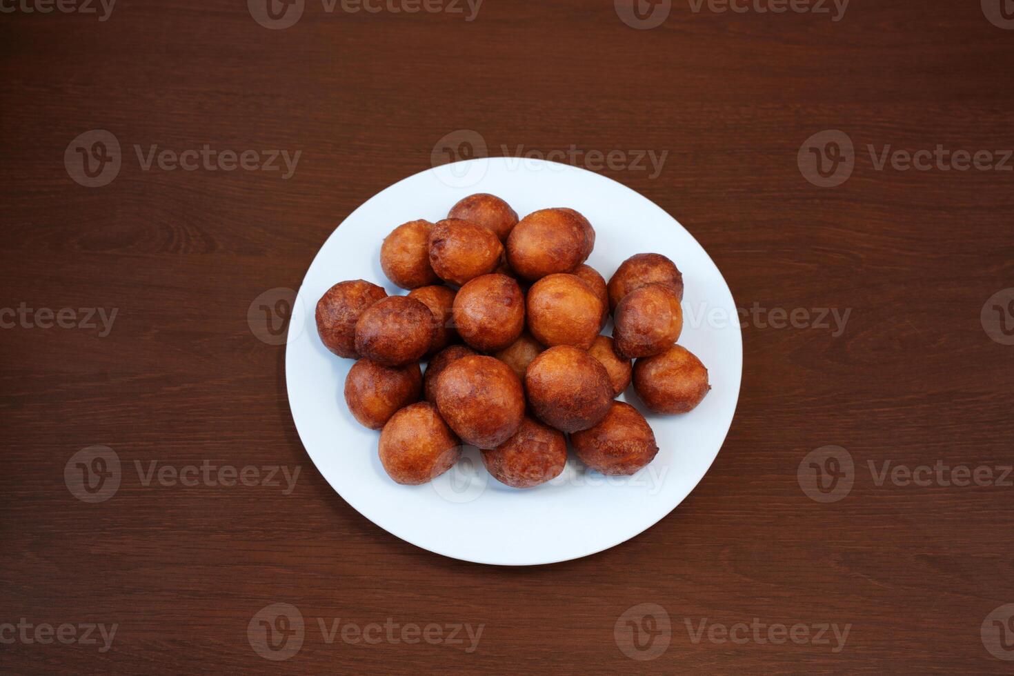 Fried donut holes beignets from an African restaurant photo