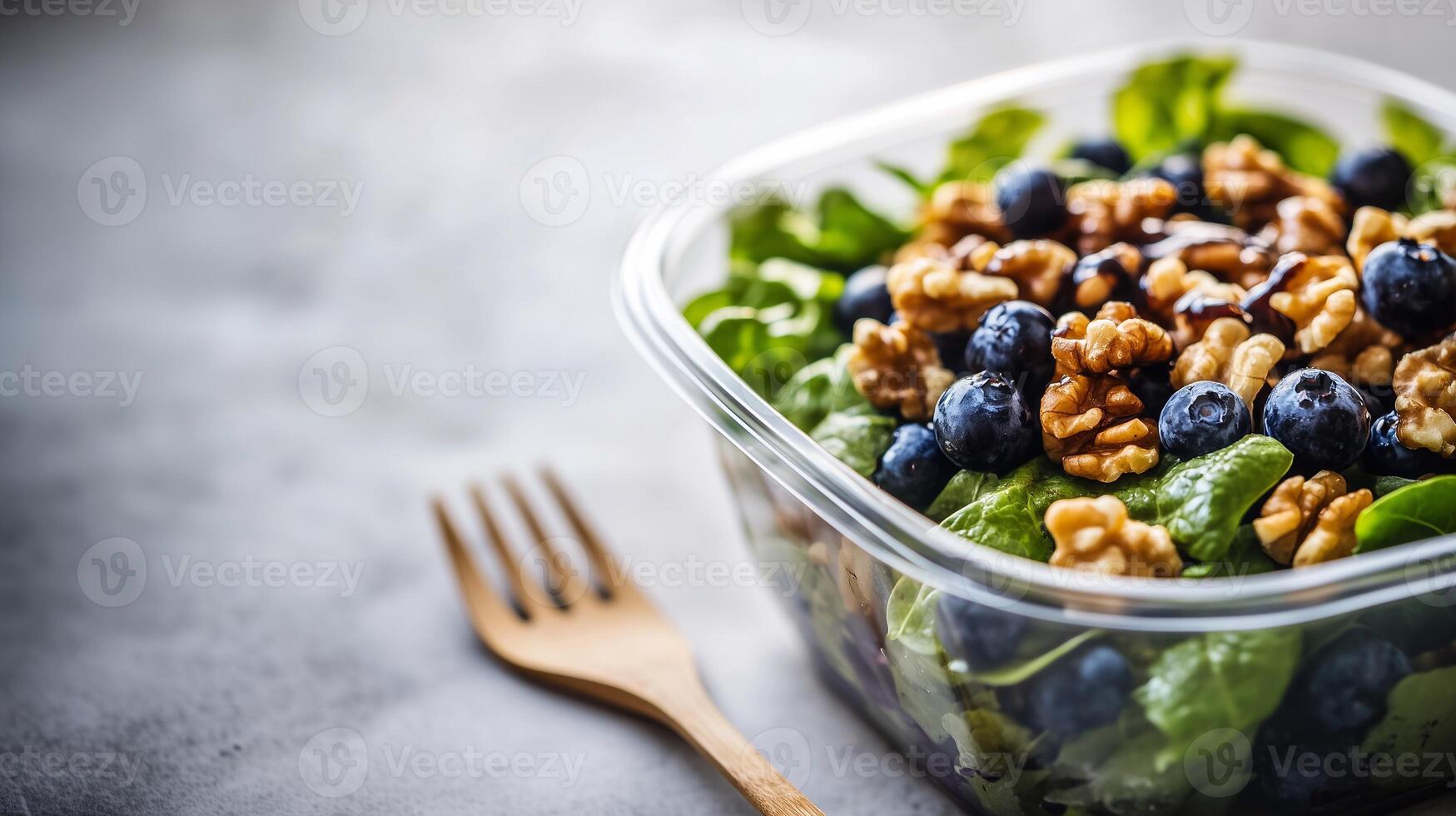 A high-quality fresh salad featuring walnuts and berries, beautifully presented with a modern aesthetic. Grab-and-Go Salad. . photo