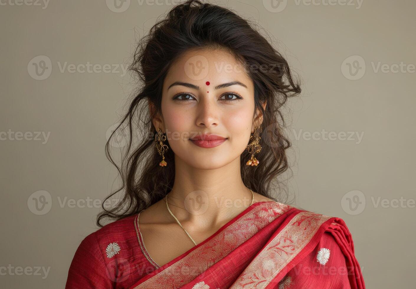 Traditional portrait beautiful woman in a red sari with gold embroidery, wearing intricate gold jewelry photo