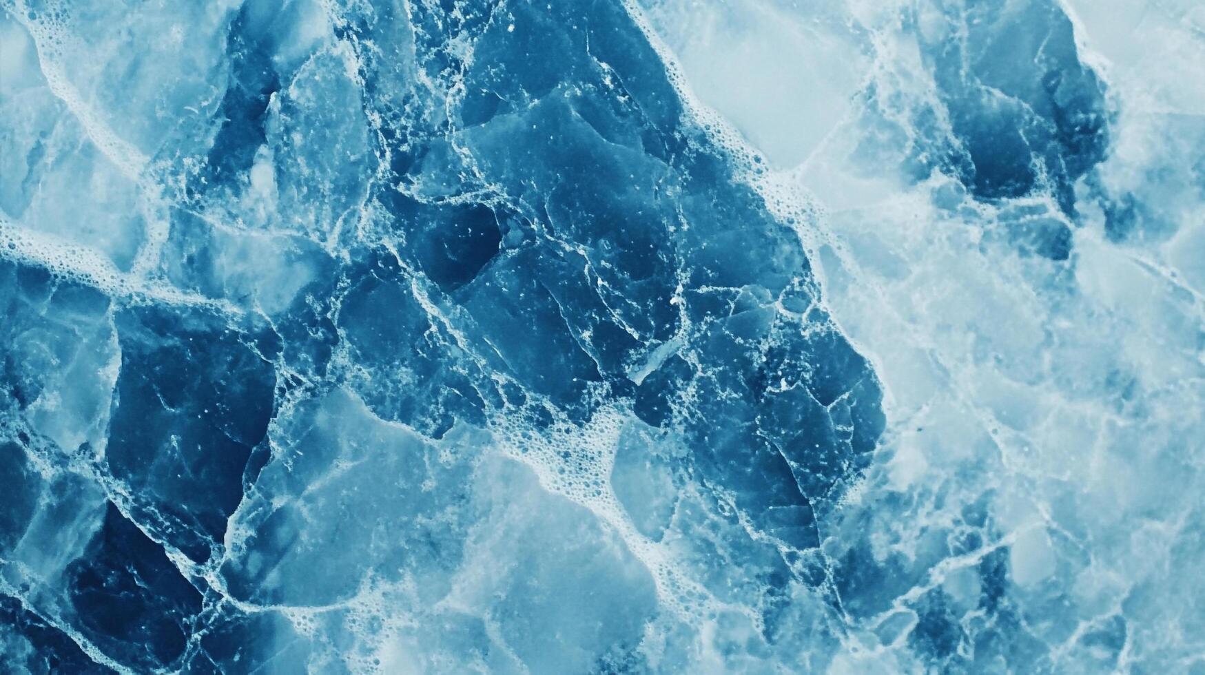 A mesmerizing abstract of marbled blue and white hues evokes fluidity, depth, and a calming visual texture. photo