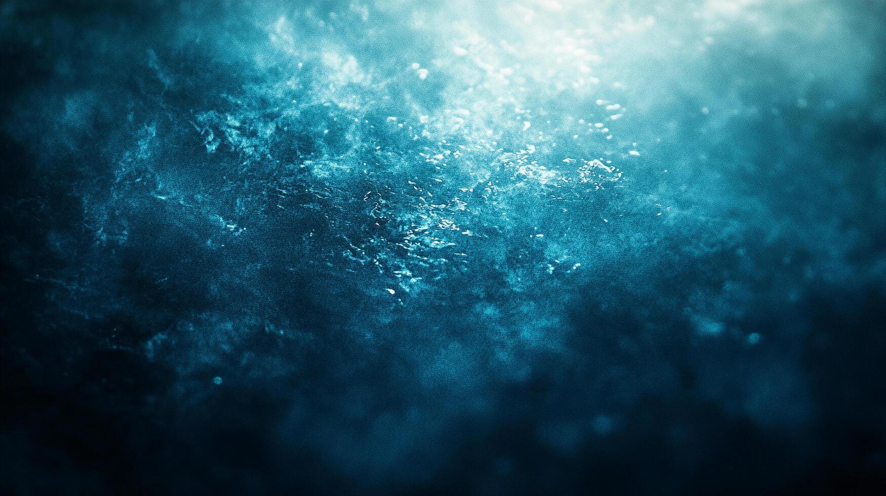 Abstract blue water with shimmering highlights and dark depths, evoking a sense of the ocean's vastness and mystery. photo