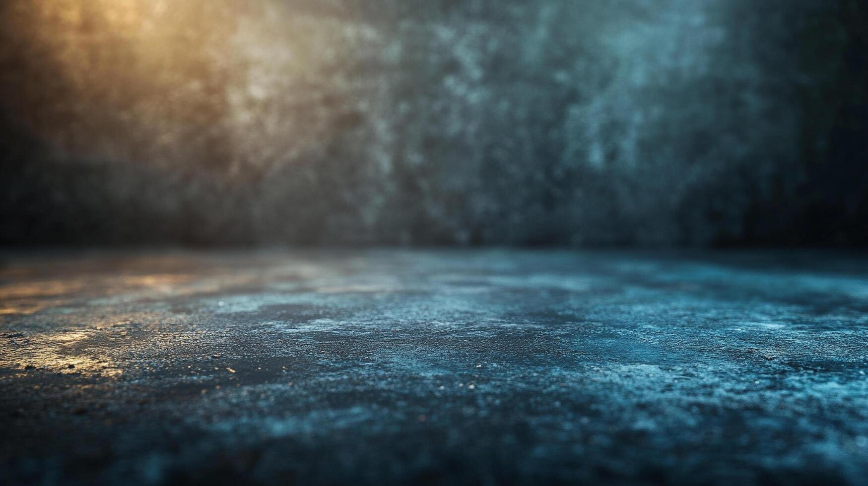 A moody, textured surface with mixed lighting and a dark backdrop. The light reflects off the surface adding to the dramatic presentation. photo