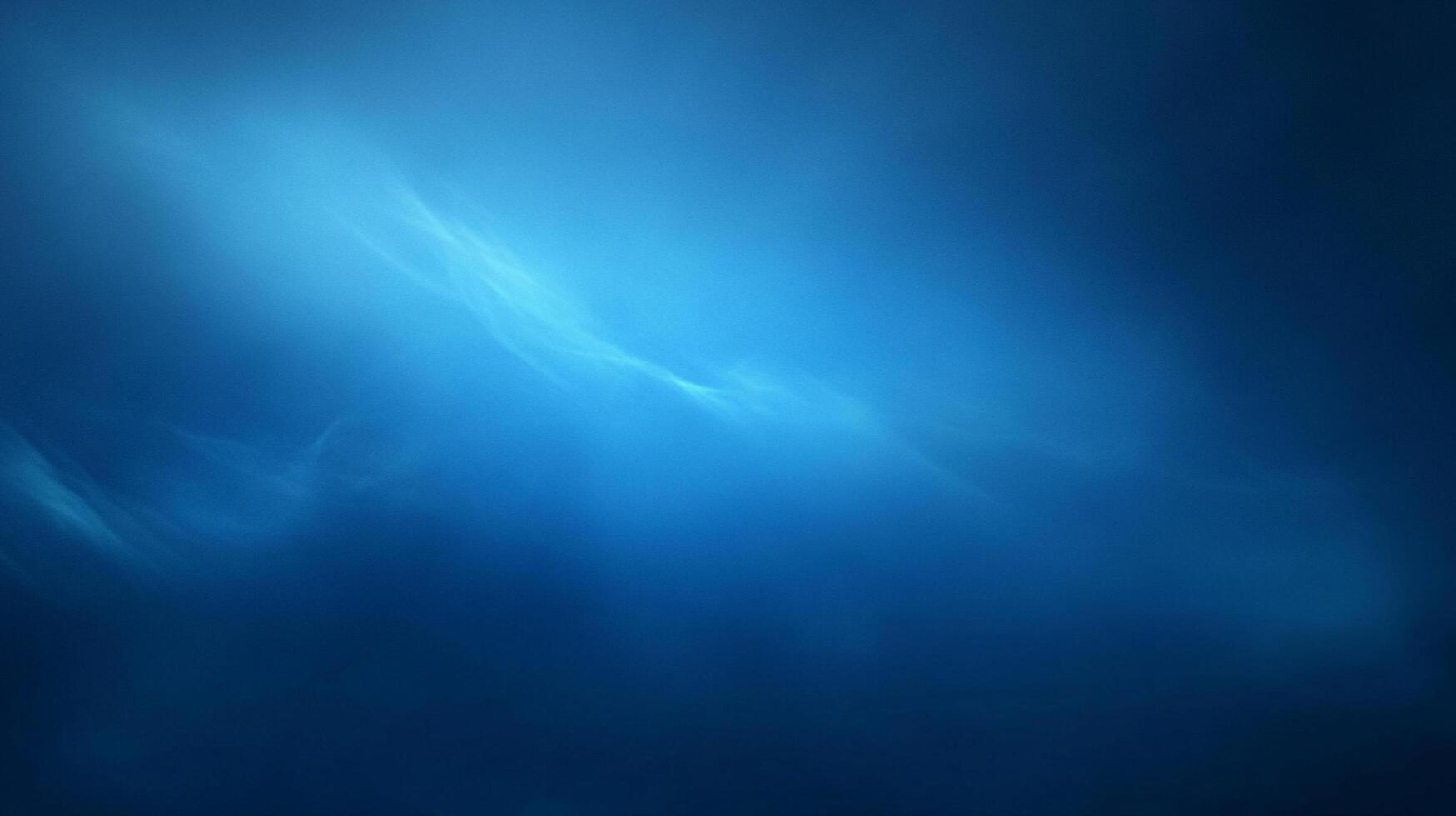 A serene blue gradient background evokes calm waters and skies, perfect for peaceful and ethereal designs with subtle, flowing textures. photo