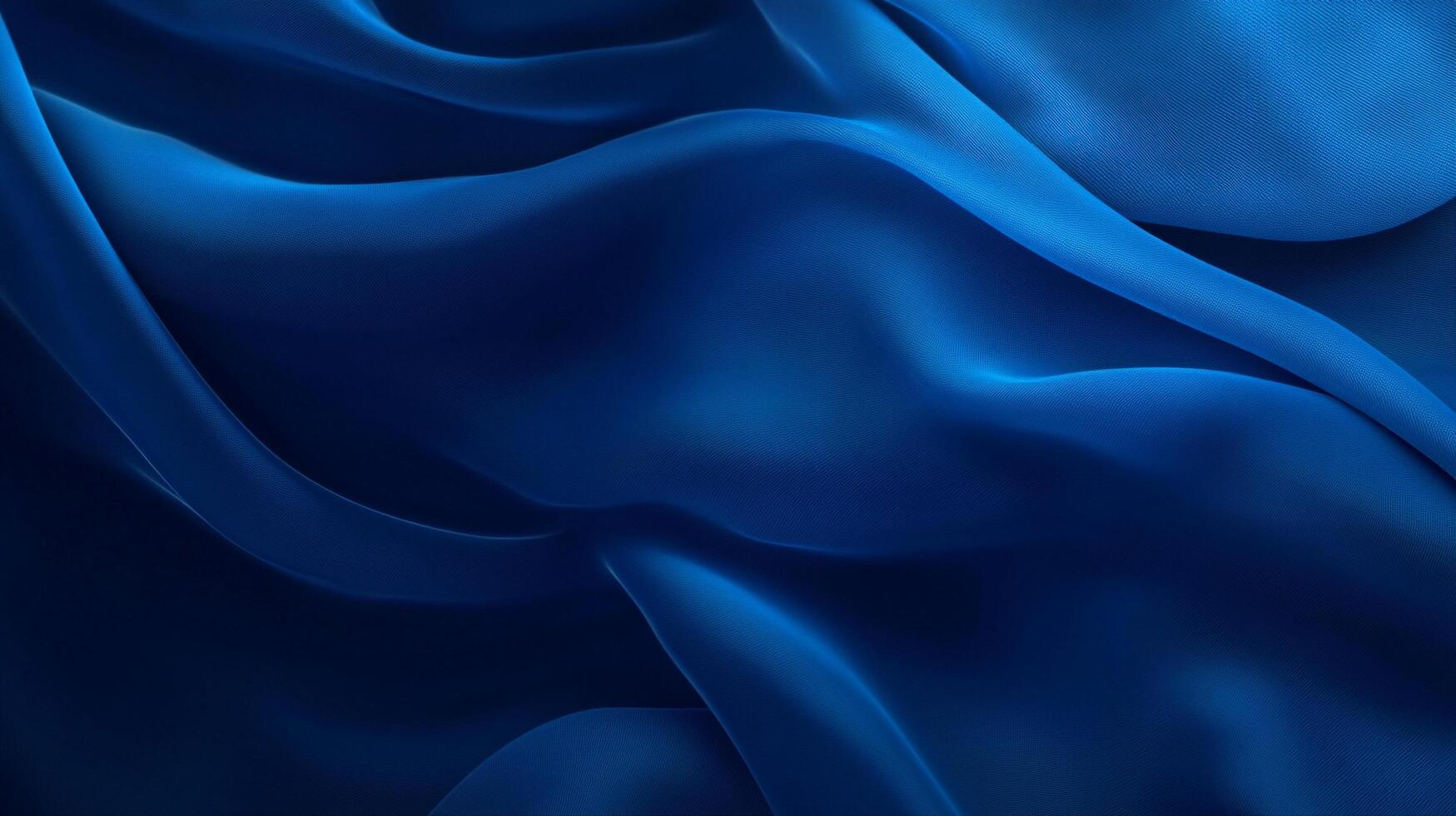 Abstract blue fabric waves, smooth and flowing, creating a sense of depth and motion with light and shadow interplay. Ideal backdrop. photo