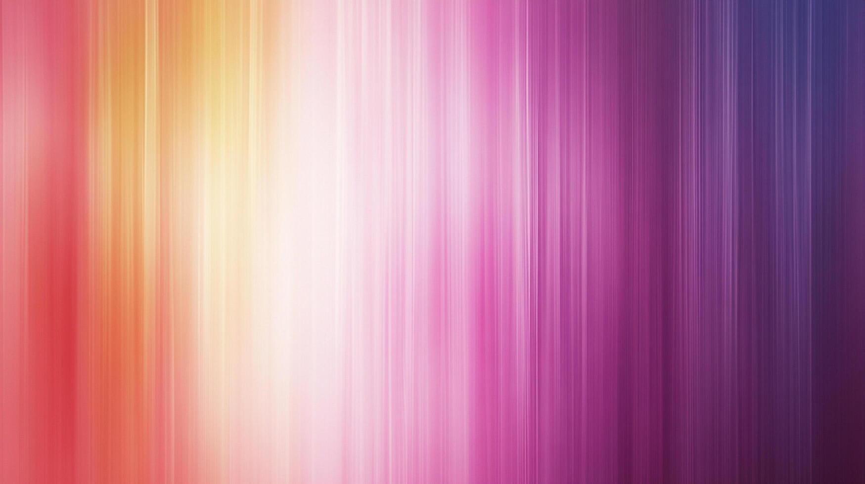Vertical stripes blend soft, saturated shades of pink, orange, and purple to create an abstract, colorful gradient design. photo