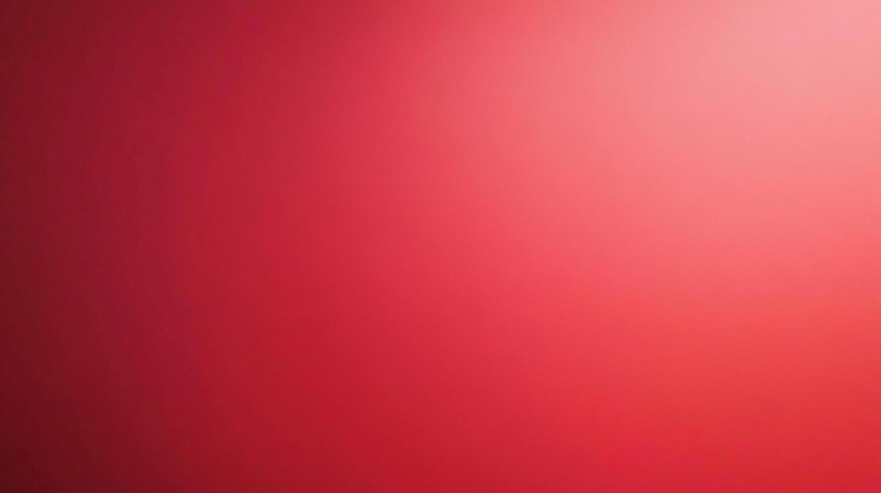 A gradient of deep red to lighter pink fills the frame, offering a visually calming and minimalist aesthetic. The color gradation is smooth. photo