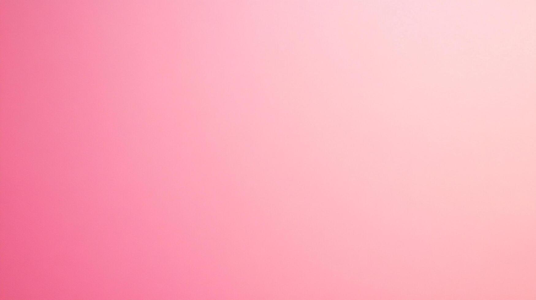 An ombre effect of pink and light pink merging to create a soft, delicate gradient. A captivating visual effect evoking warmth and calmness. photo