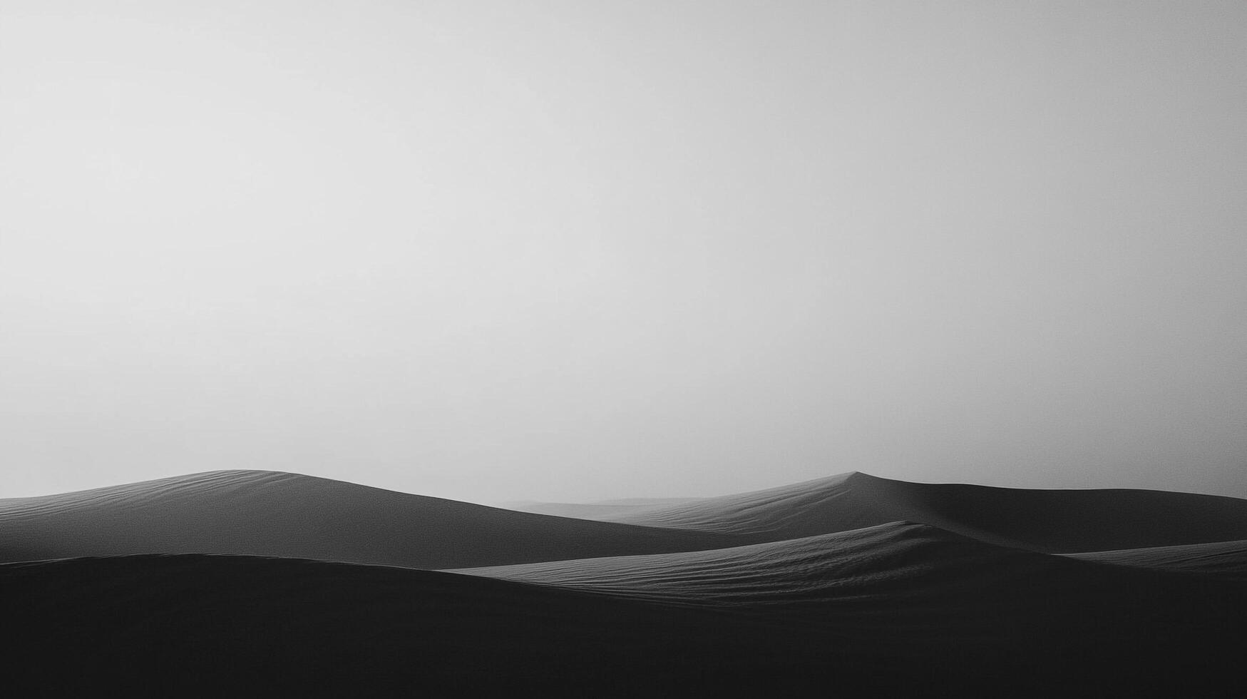Monochromatic view of undulating sand dunes, soft light, stark contrast, shadows, grayscale, peaceful and serene desert landscape photo