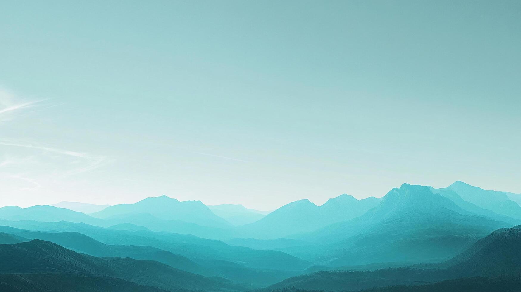 A serene landscape of mountainous terrain fades into the distance, veiled in cool, tranquil tones of teal and aqua under a soft, airy sky. photo