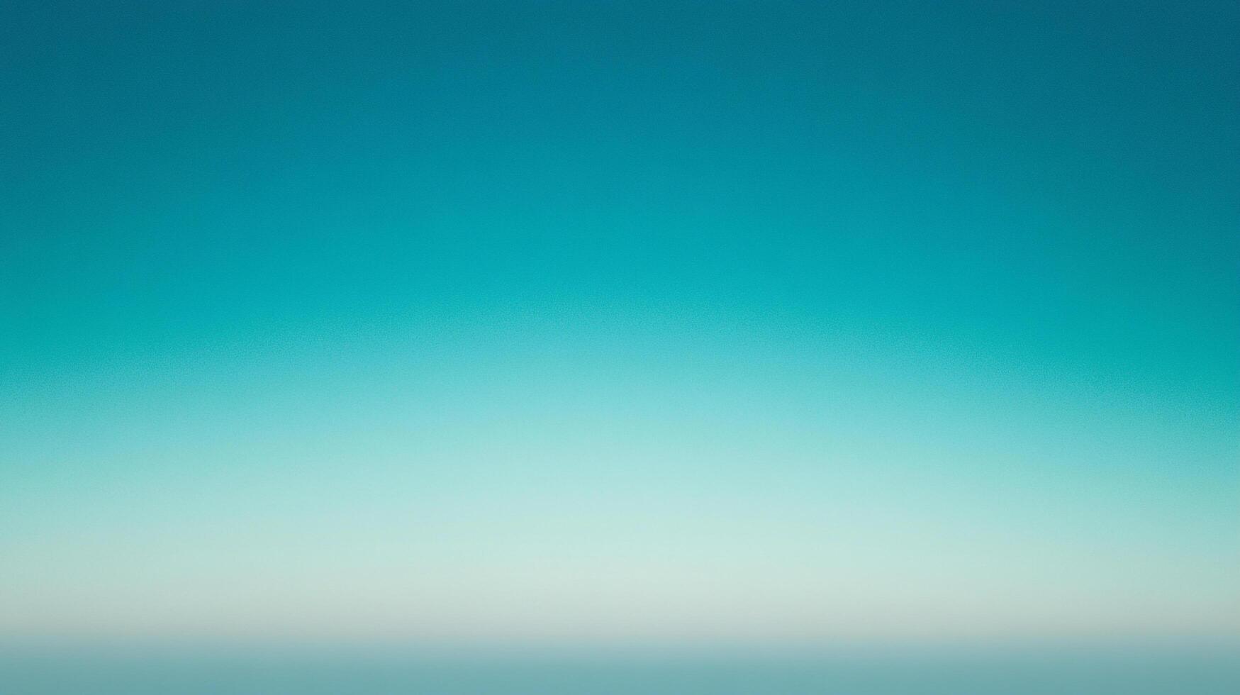 A gradient of calming blues fades from a saturated turquoise at the top to a soft, muted teal at the bottom, suggesting vastness. photo