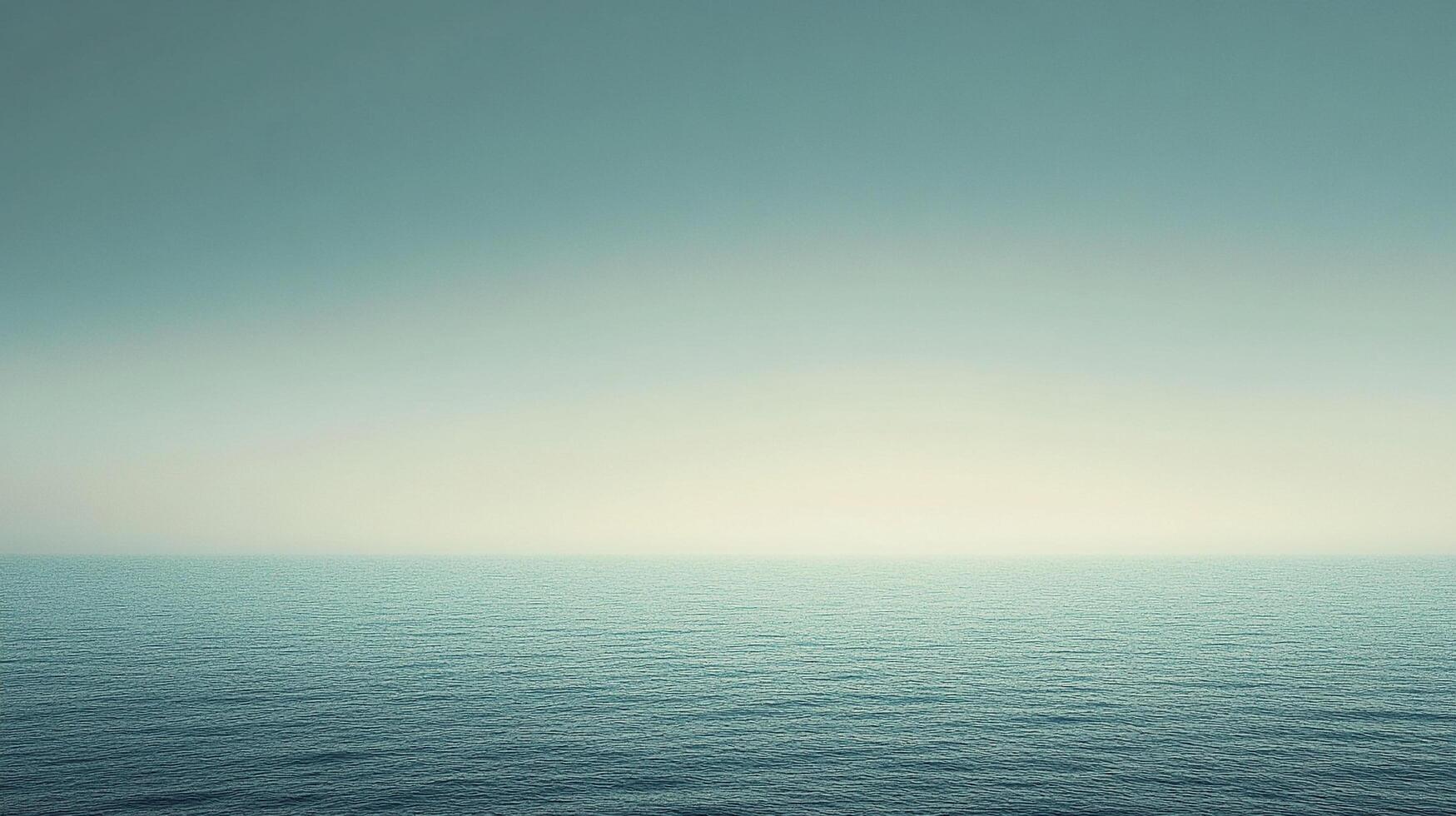 Calm, blue ocean stretches to the horizon under a soft, gradient sky, creating a peaceful and serene seascape scene photo