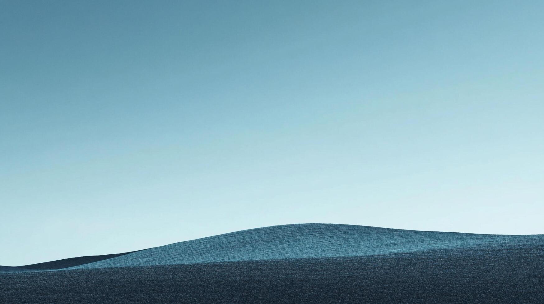 A minimalistic landscape of a smooth, sloping hill against a soft, pale blue gradient sky evokes serenity and a sense of natural calmness. photo
