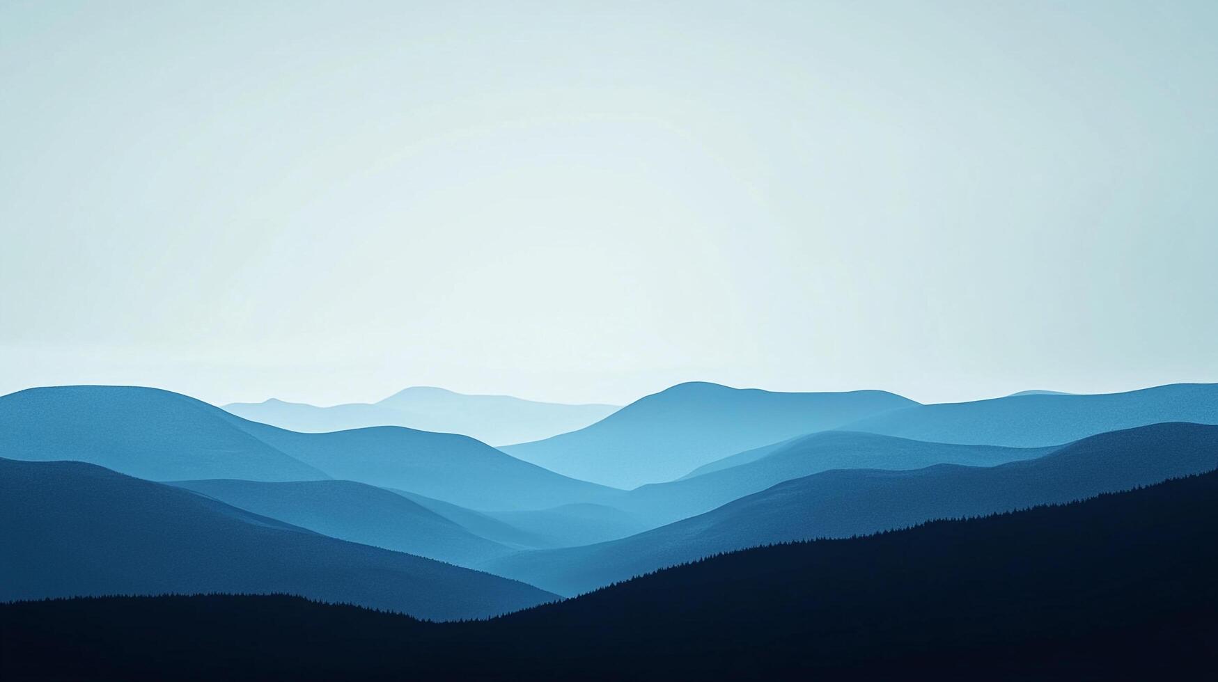 Serene mountain range fading into the horizon. Cool blues create a sense of depth and peace. The crisp sky hints at a clear day. photo