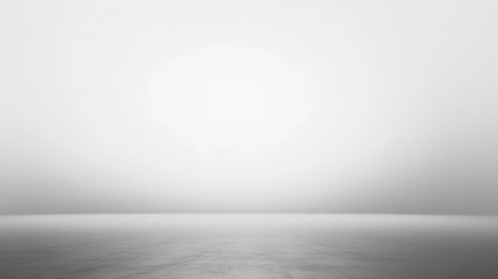 Monochromatic abstract background. The gray floor leads to a pale light. The image has a minimalist feel and muted color palette. photo