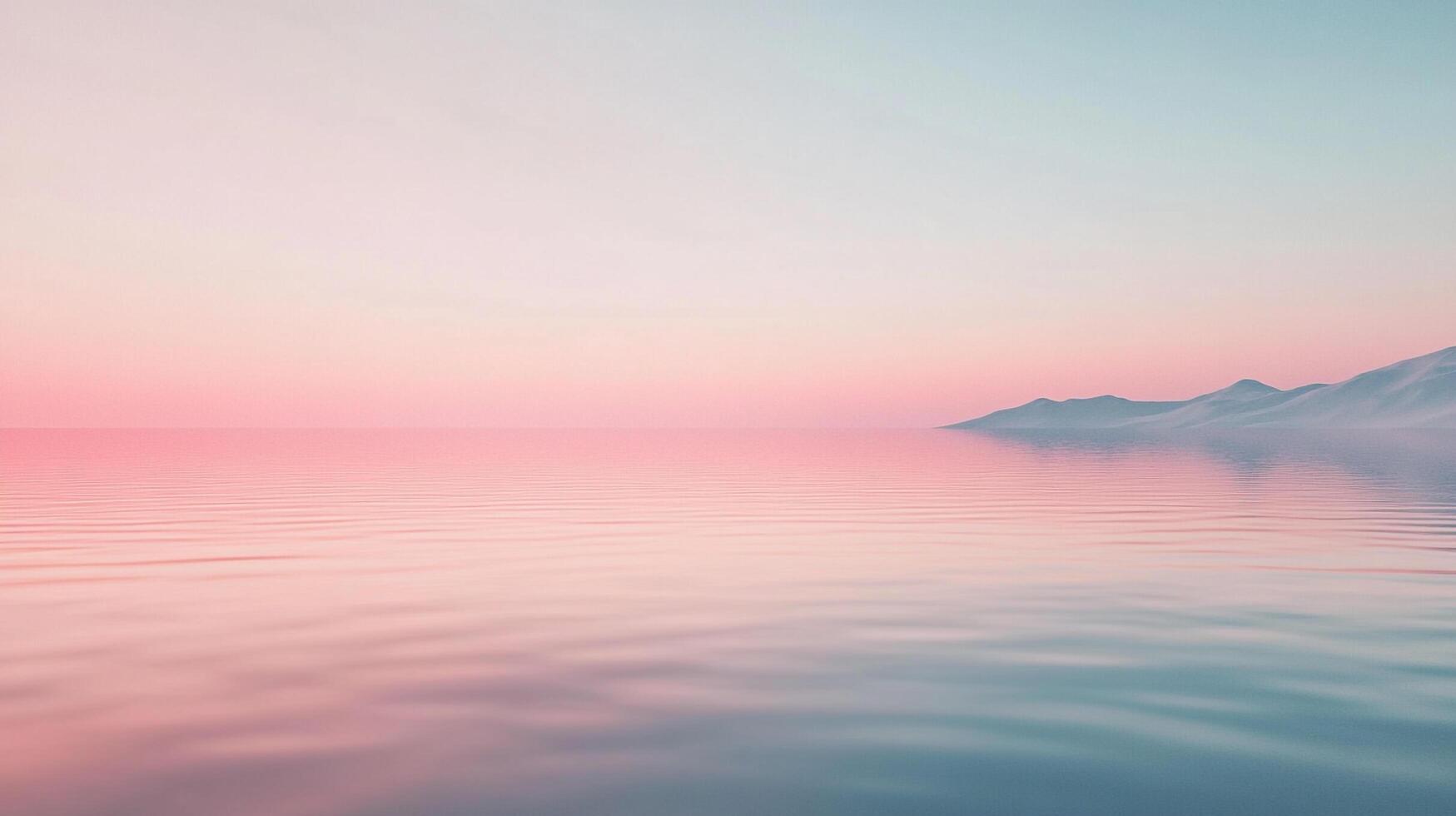 Serene seascape featuring a calm ocean reflecting a pastel sky, with distant snow-capped mountains adding to the tranquil atmosphere. photo