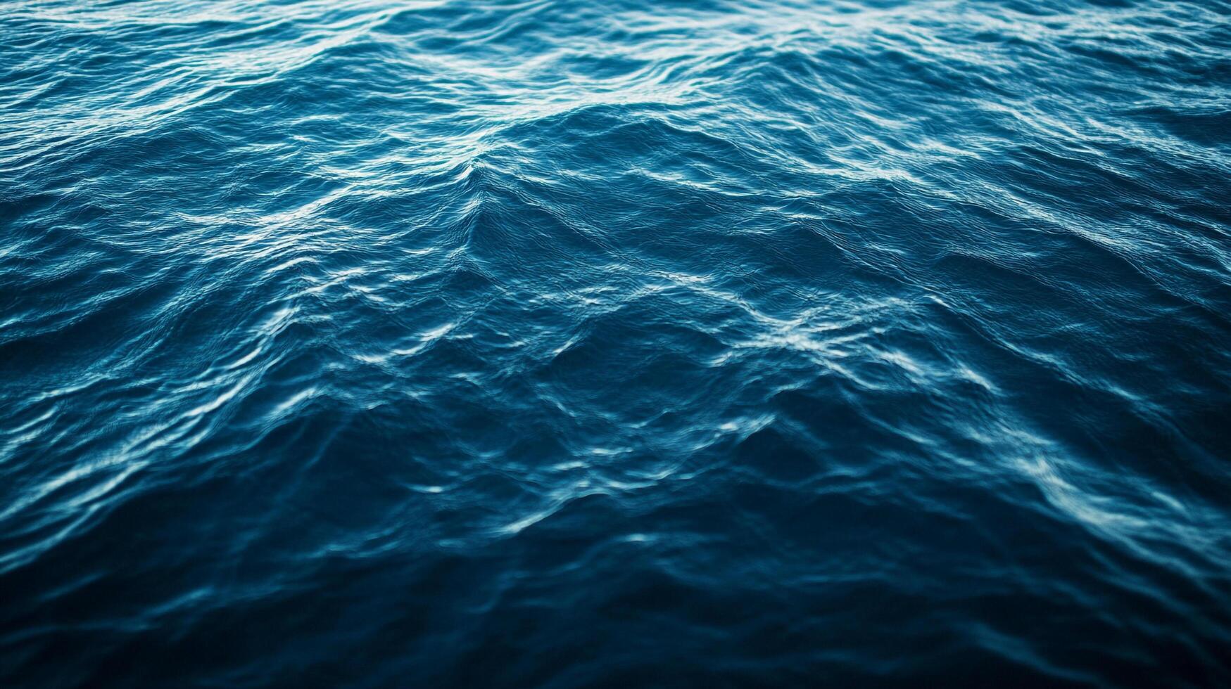 Vast expanse of ocean water with gentle ripples and wavelets, showcasing the serene beauty and tranquility of the open sea. photo