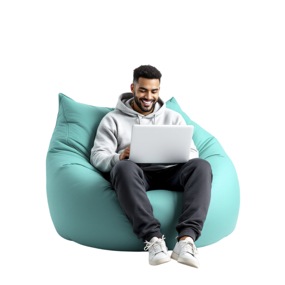 A man sitting on a bean bag chair with a laptop png