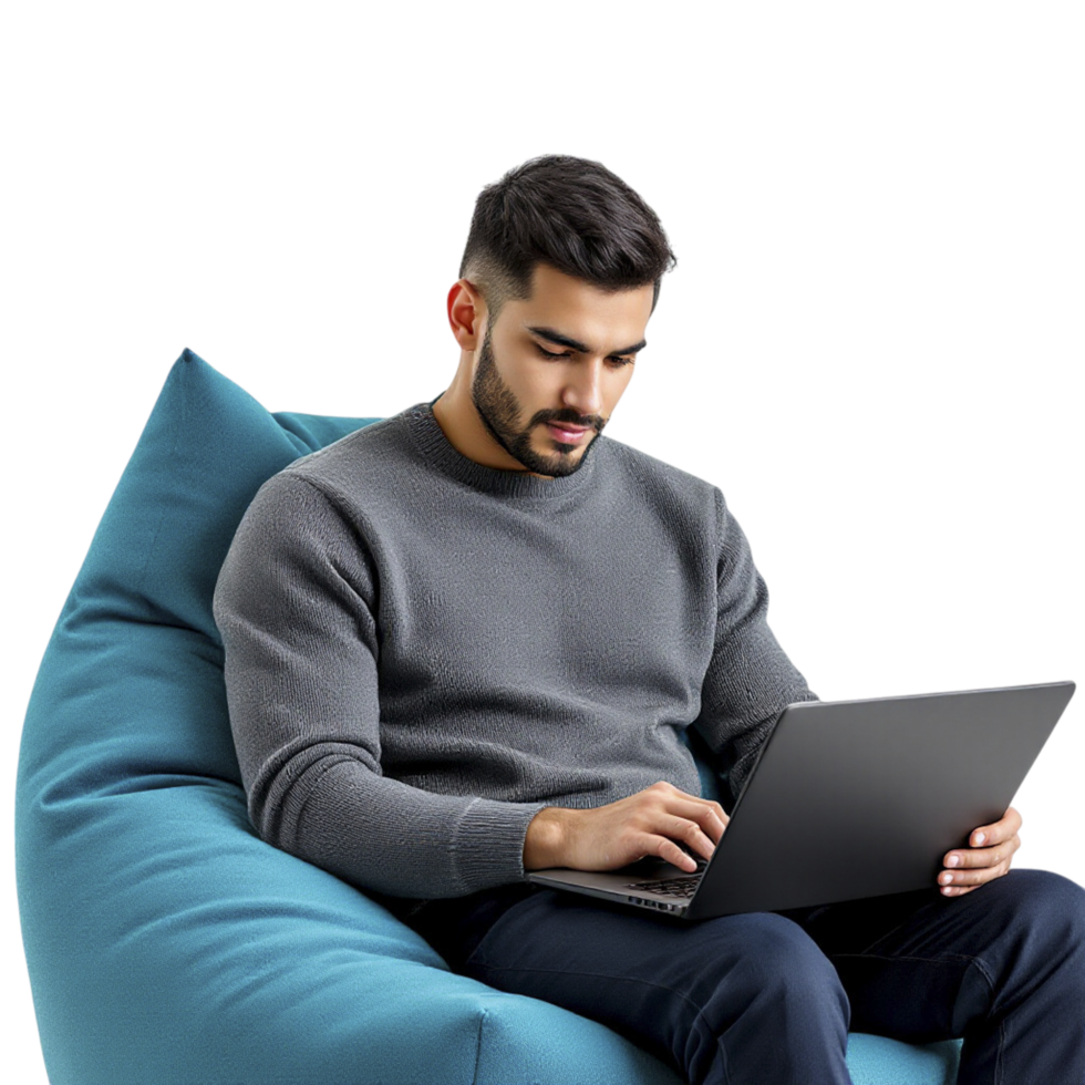 A man sitting on a bean bag chair with a laptop png