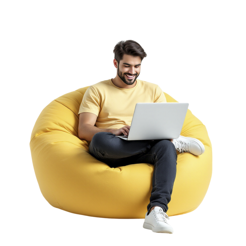 A man sitting on a bean bag chair with a laptop png