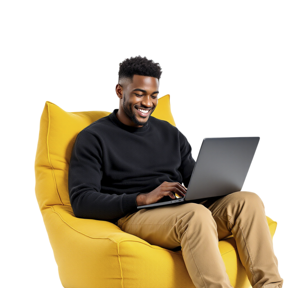 A man sitting on a bean bag chair with a laptop png