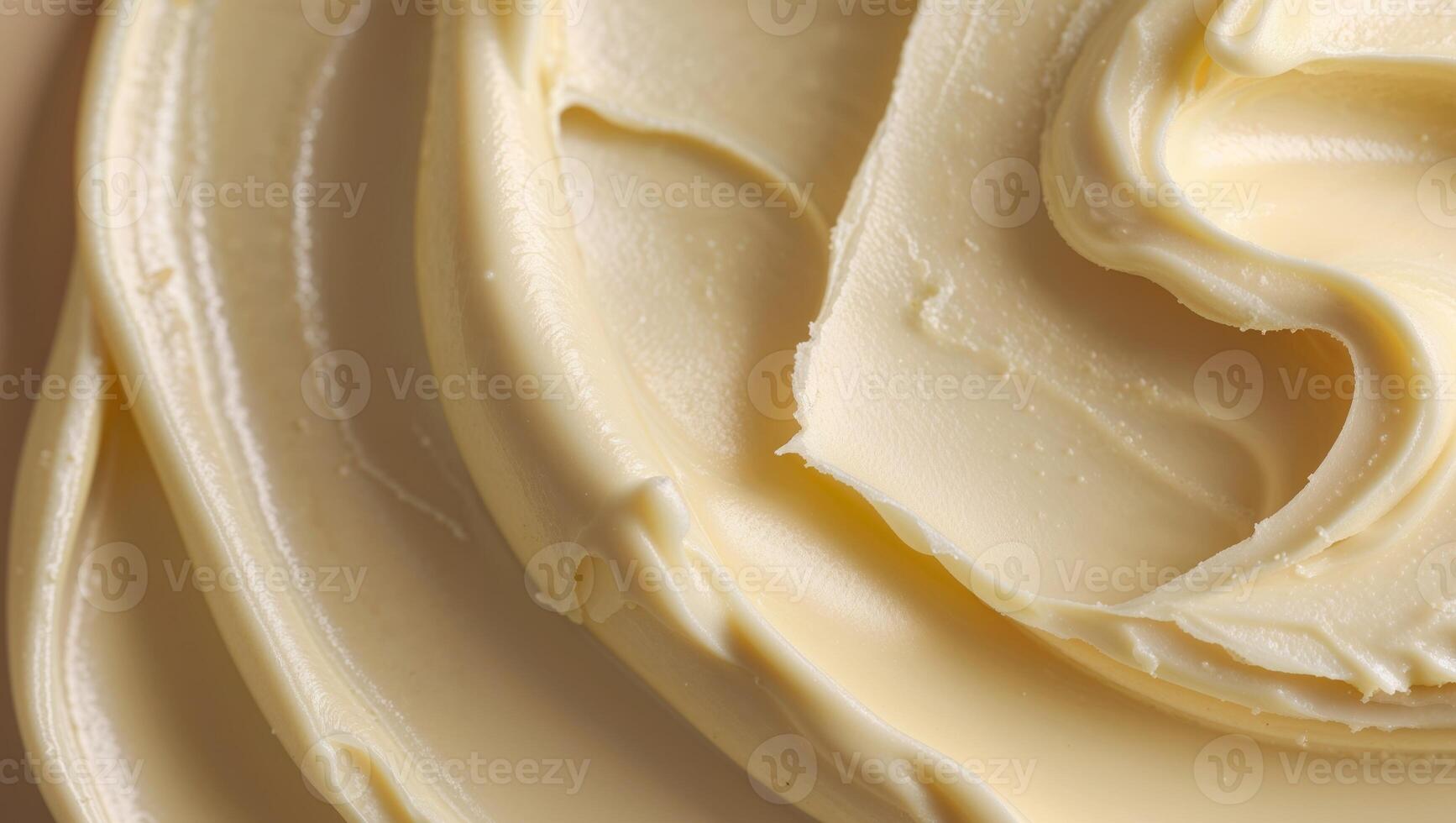 A close up of a white frosting on a brown surface photo