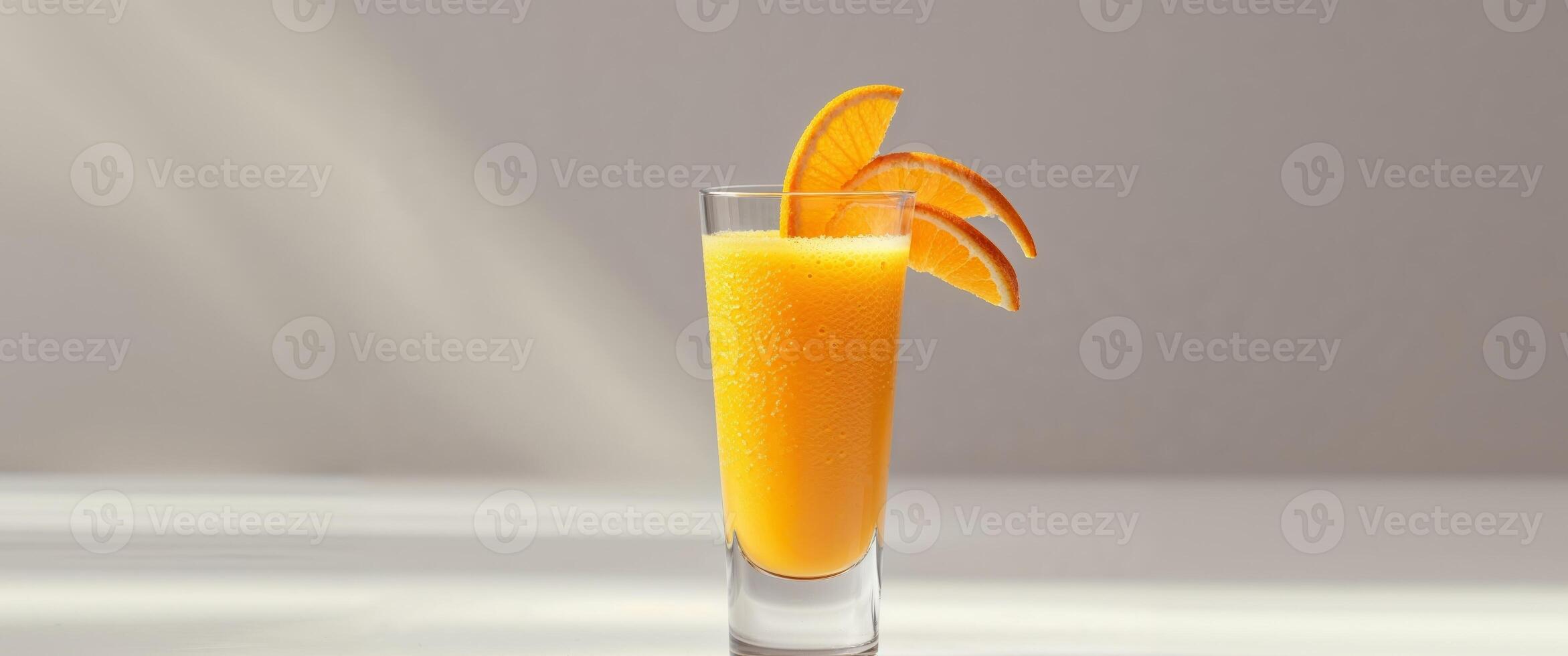 A glass with an orange slice in it photo